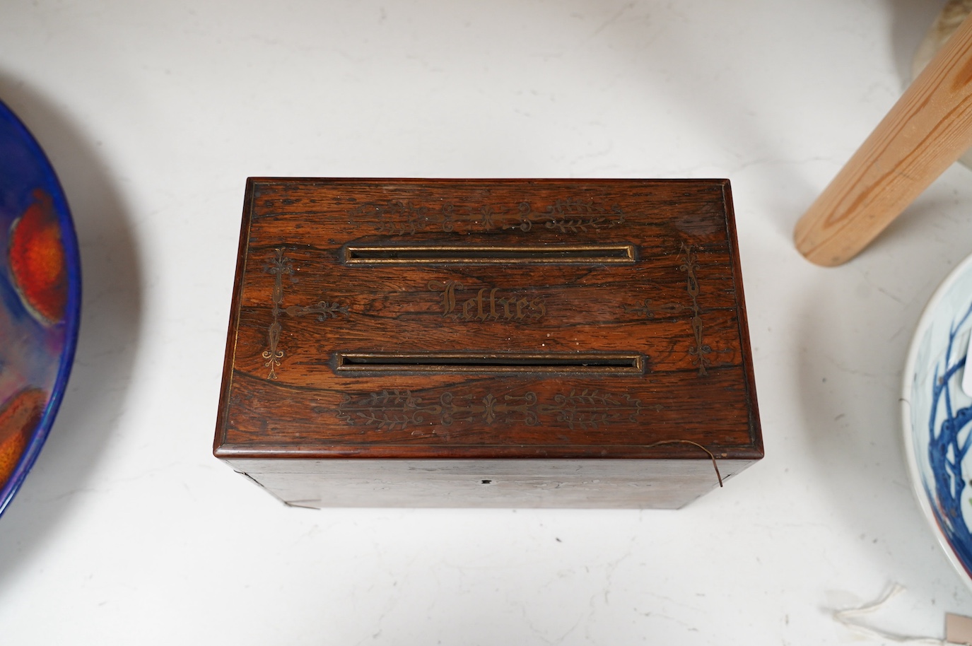 A George IV cut brass inlaid rosewood ‘letters’ box, satinwood interior, 23cm wide. Condition - fair